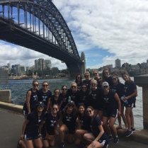 Dawgs pose for a team photo in front of the Harbour Bridge
